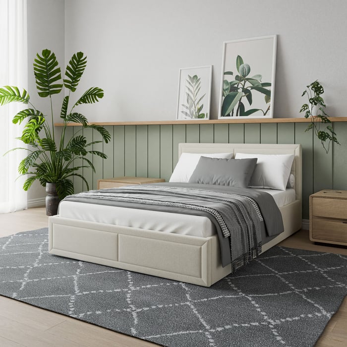 The upholstered ottoman bed Jayden double size, beige colour in a cosy bedroom.