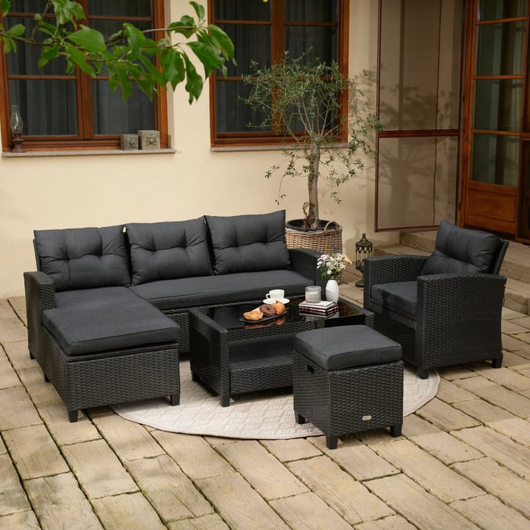 The garden furniture set DALMIA in black in a cosy terrace.