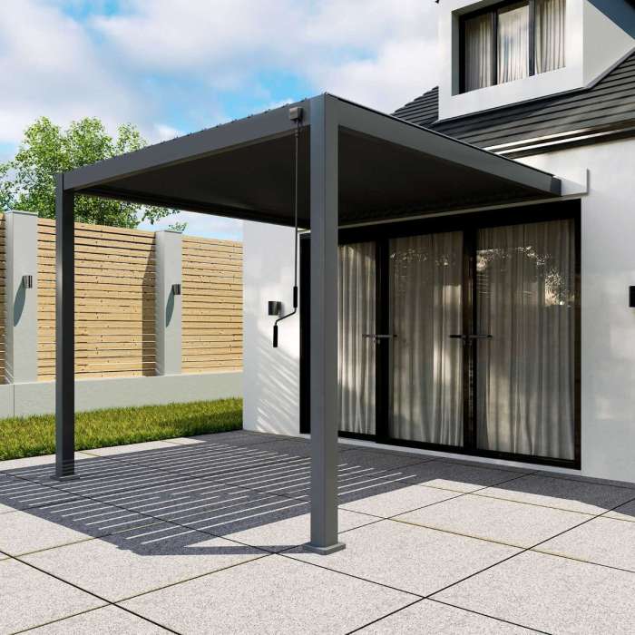 Titan Aluminium Wall Mounted Pergola - 3m Square - Grey attached to a house.
