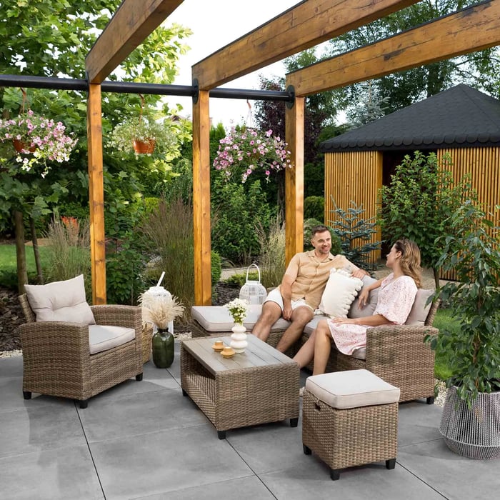 The garden furniture set DALMIA in beige in a modern patio.