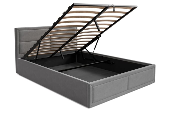 Upholstered ottoman bed Jayden presenting storage compartment.