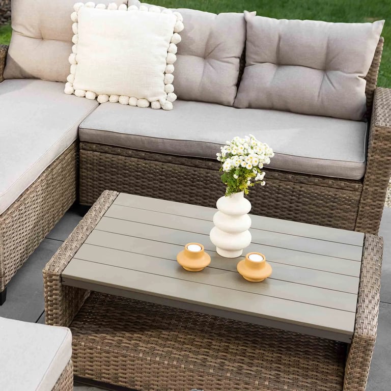 The garden furniture set DALMIA in beige presenting a coffee table.
