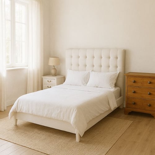 Minimalist white bedroom with tufted headboard