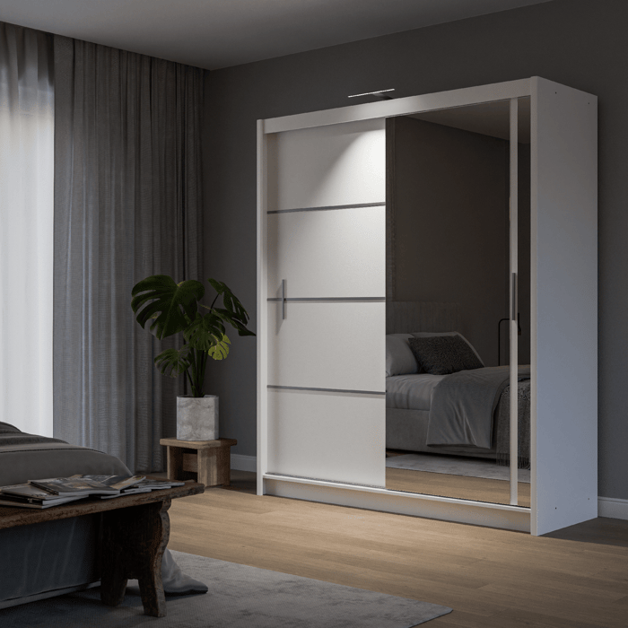 The sliding door VISTA 180cm white displaying the LED in a cosy bedroom.